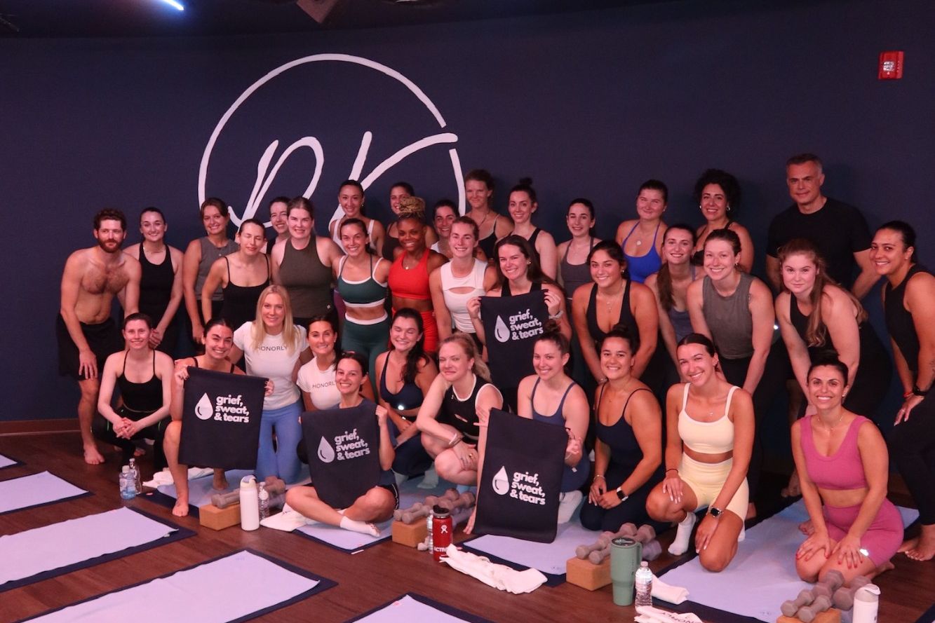 The whole class gathered at the front of the studio at the end, some holding Grief, Sweat and Tears towels.